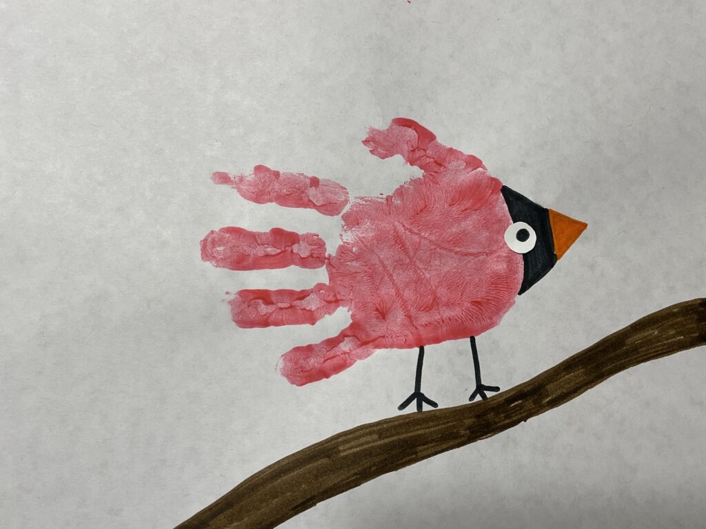 red winter bird made with a handprint